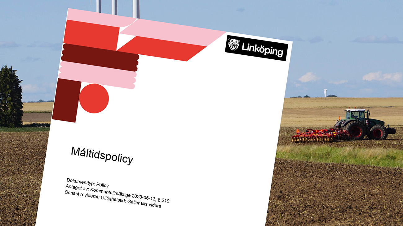Framsidan av måltidspolicyn med ett odlingslandskap i bakgrunden